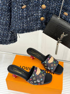 Black slide sandals with multicolor monogram-pattern straps, open-toe