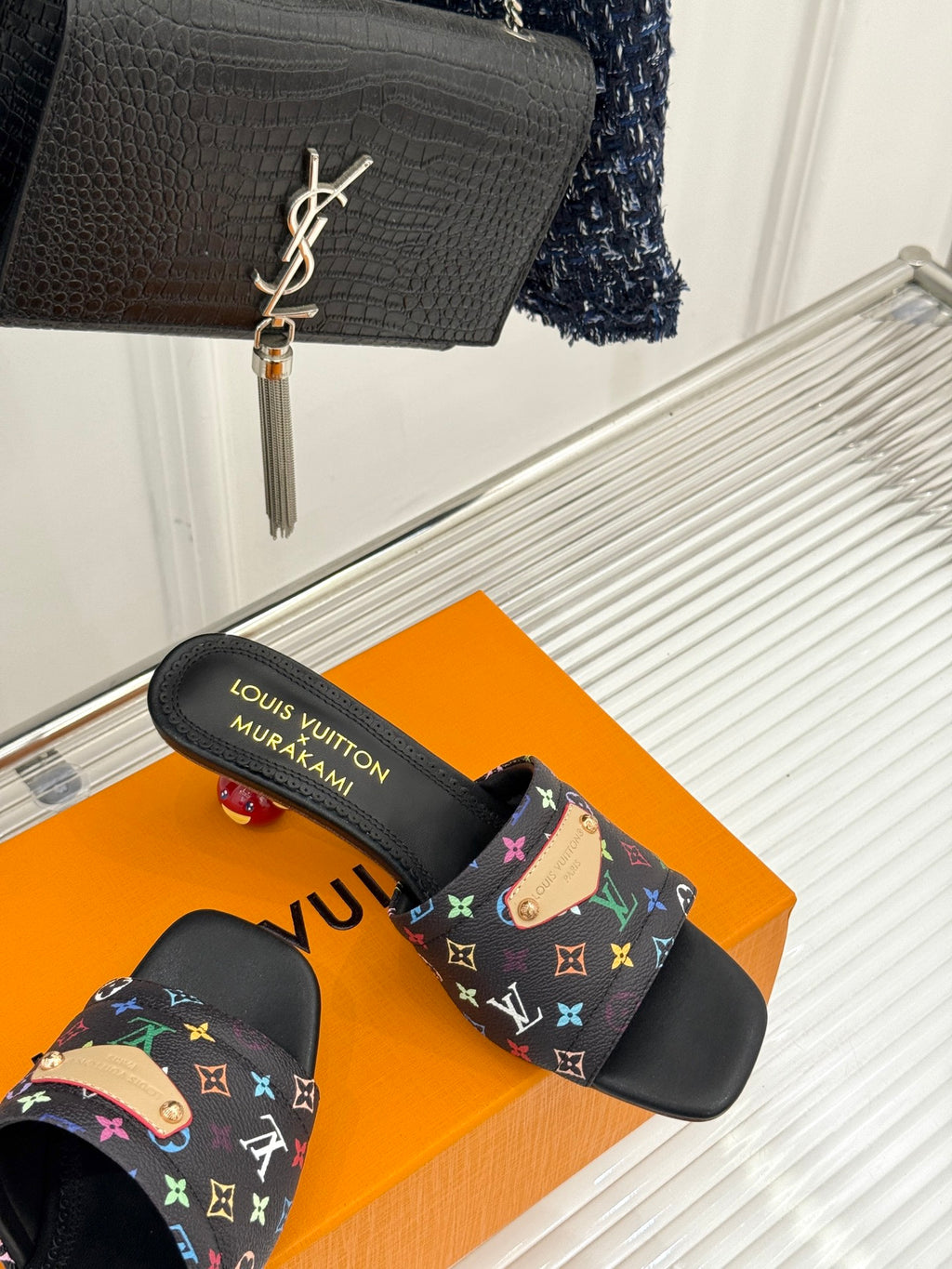 Black slide sandals with multicolor monogram-pattern strap and branded insole