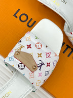 White slide sandal with multicolor monogram logo strap and gold hardware