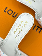 White slide sandal insole with embossed text and stitched edges
