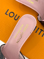 Louis Vuitton pink slide sandal footbed with gold embossed logo text
