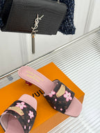 Louis Vuitton slide sandals with dark floral print straps and light pink open-toe