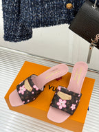 Louis Vuitton slide sandals, pink slide bands with floral black upper and gold buckle
