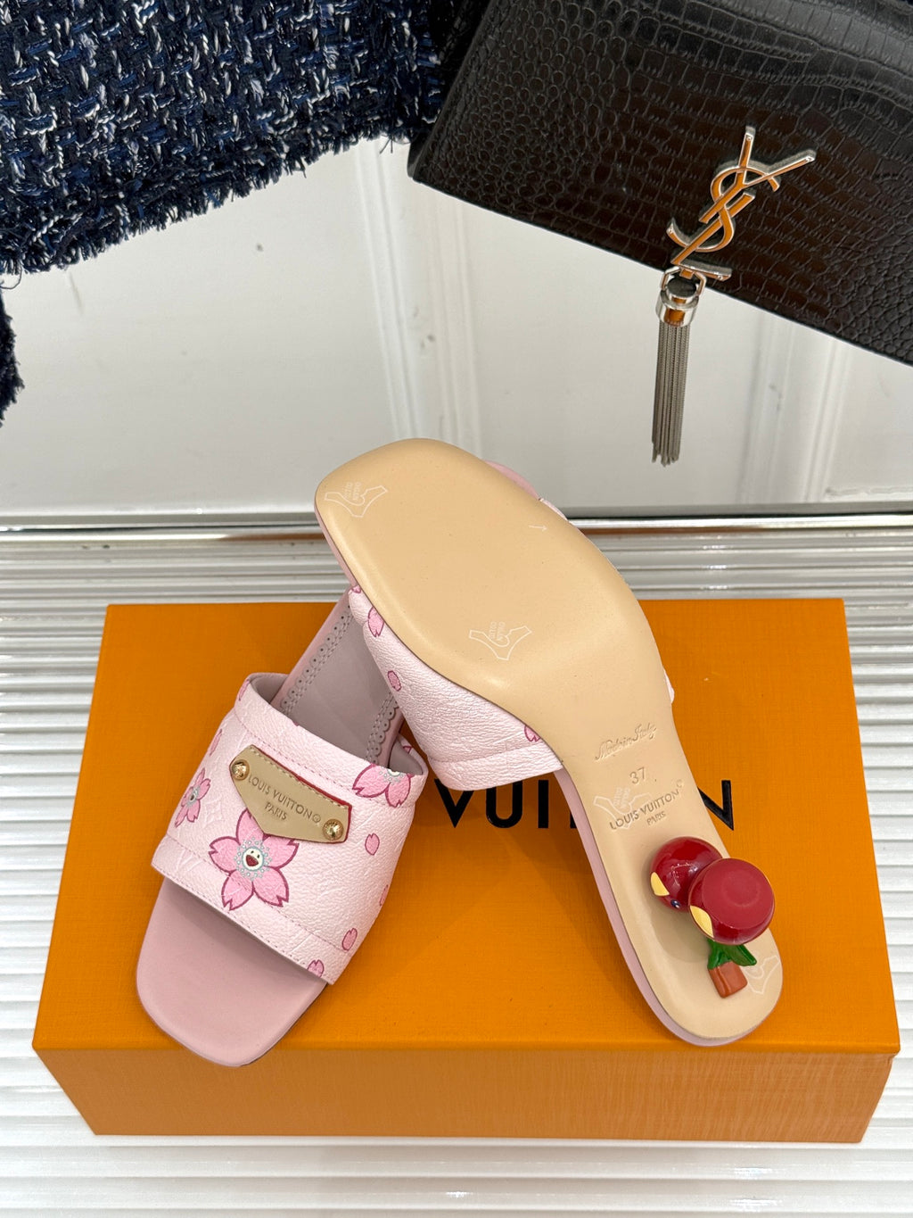 Louis Vuitton ladies pink floral slide sandals with beige outsole, side view