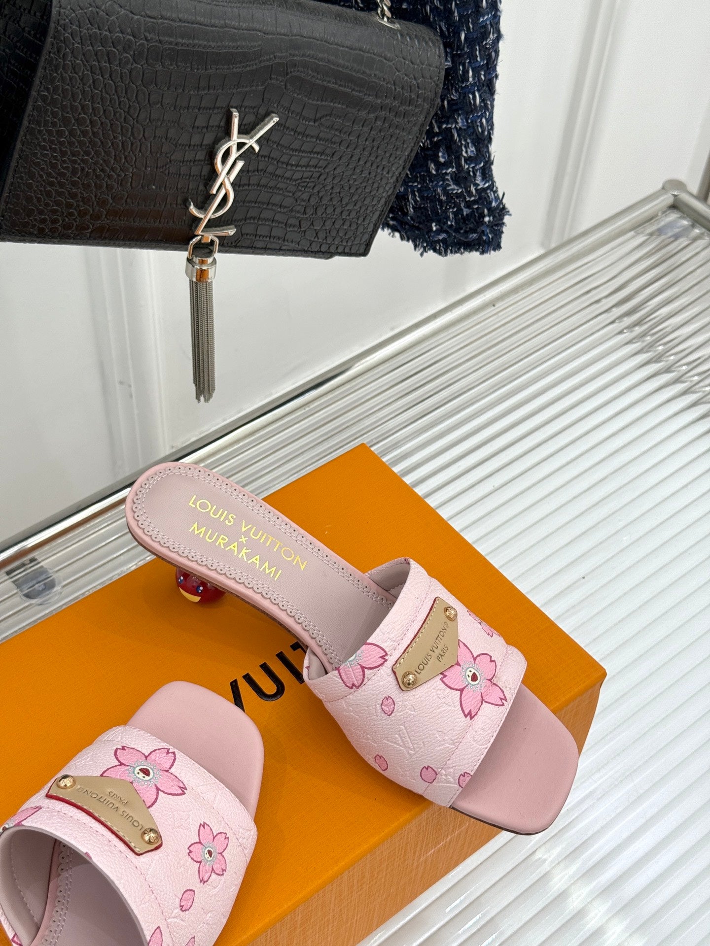 Louis Vuitton ladies pink floral slide sandals, side view with textured strap