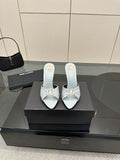 Women’s YSL pointed-toe mule sandals, light blue with stiletto heel and knot strap