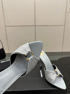 Women’s YSL light blue mule sandals, close-up of back strap and stiletto heel