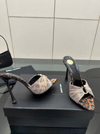 YSL ladies heeled mule sandals viewed from side, leopard print and bow strap design