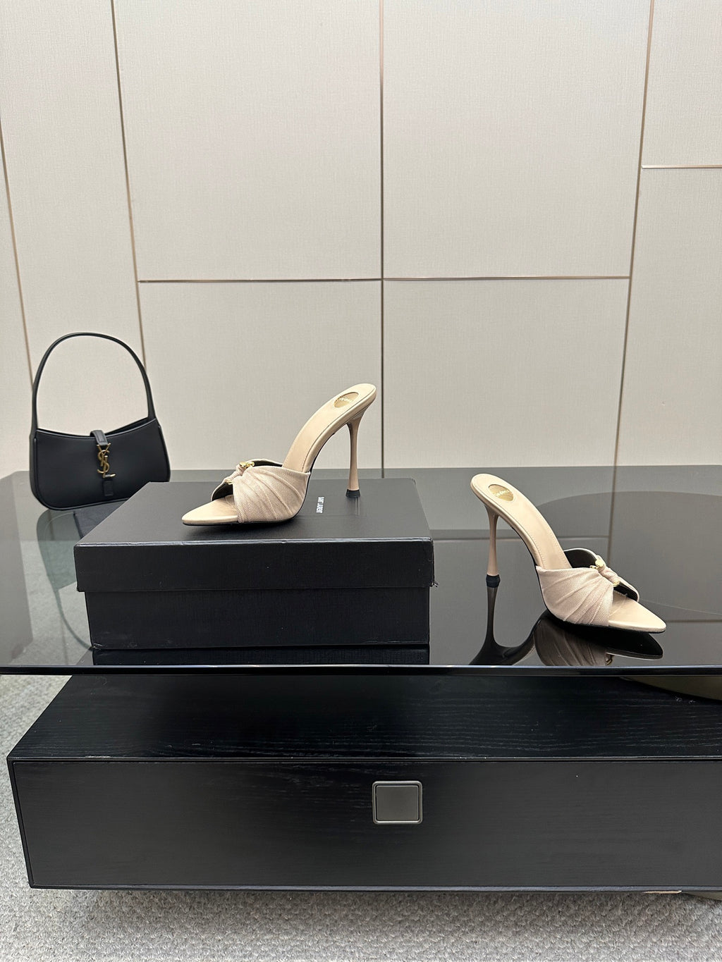 Cream heeled mule sandals with bow detail and slim stiletto heel, full pair view.