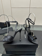 Black strappy stiletto heeled sandals with peep toe and ankle buckle strap