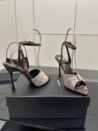 YSL ladies peep-toe stiletto sandals with thin straps and bow at ankle, side angle