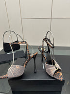 YSL ladies peep-toe stiletto sandals showing patterned heel straps and ankle bow detail