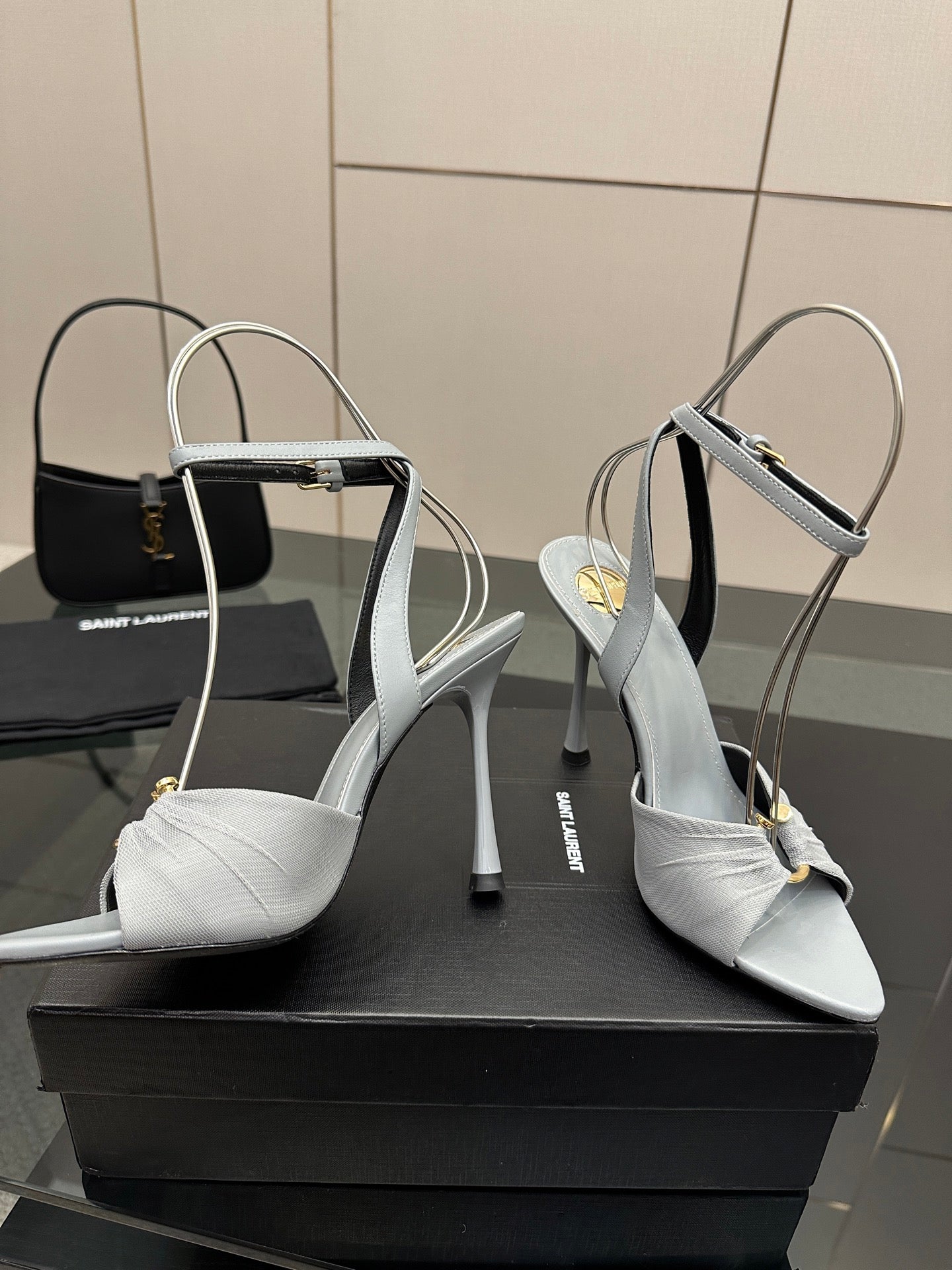 Women’s light-blue peep-toe heeled sandals with ankle strap and stiletto heel
