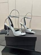 Pair of women’s light-blue peep-toe heeled sandals with ankle strap and stiletto heel
