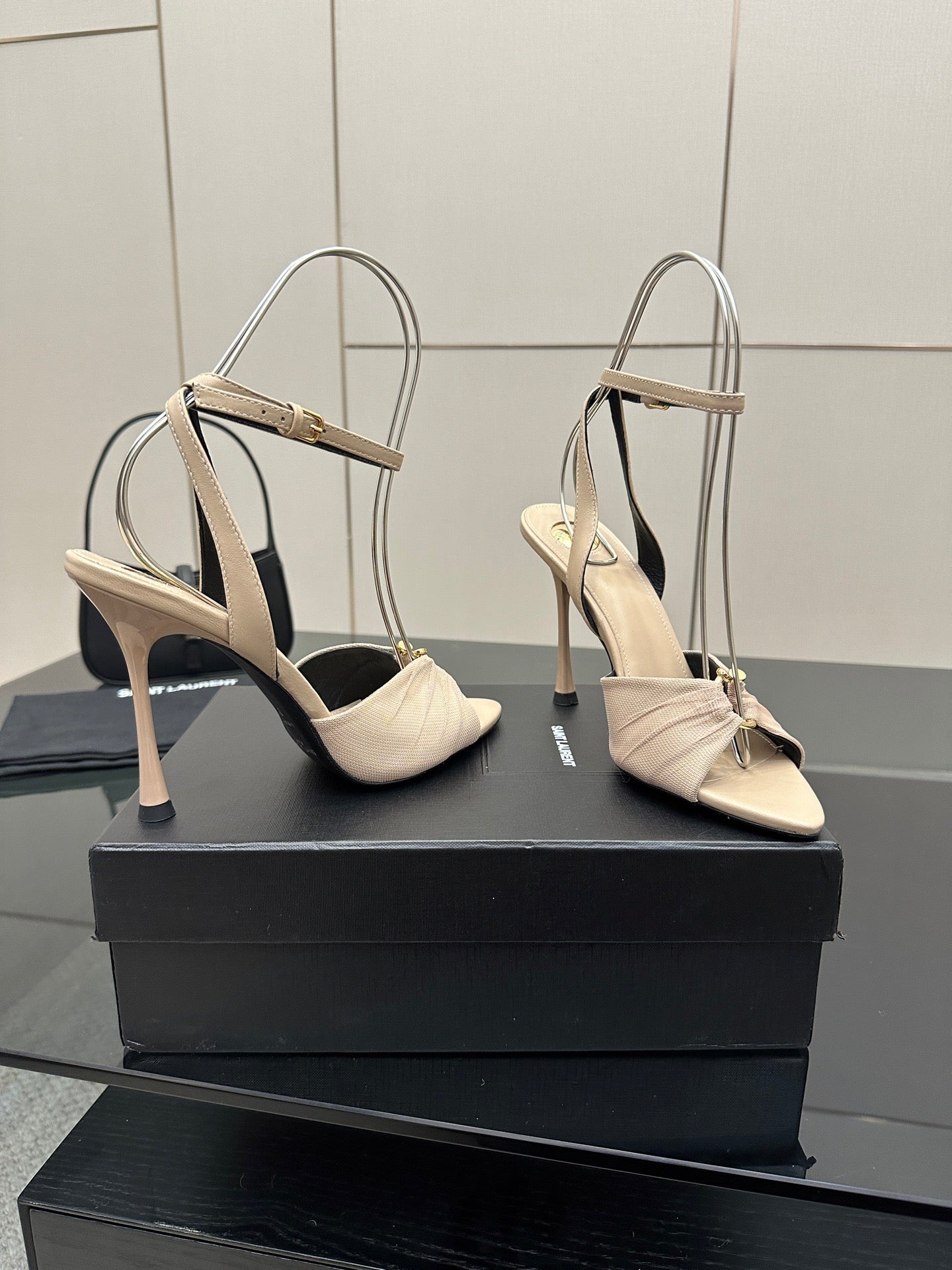 YSL ladies beige strappy heeled sandals with slingback straps, angled view
