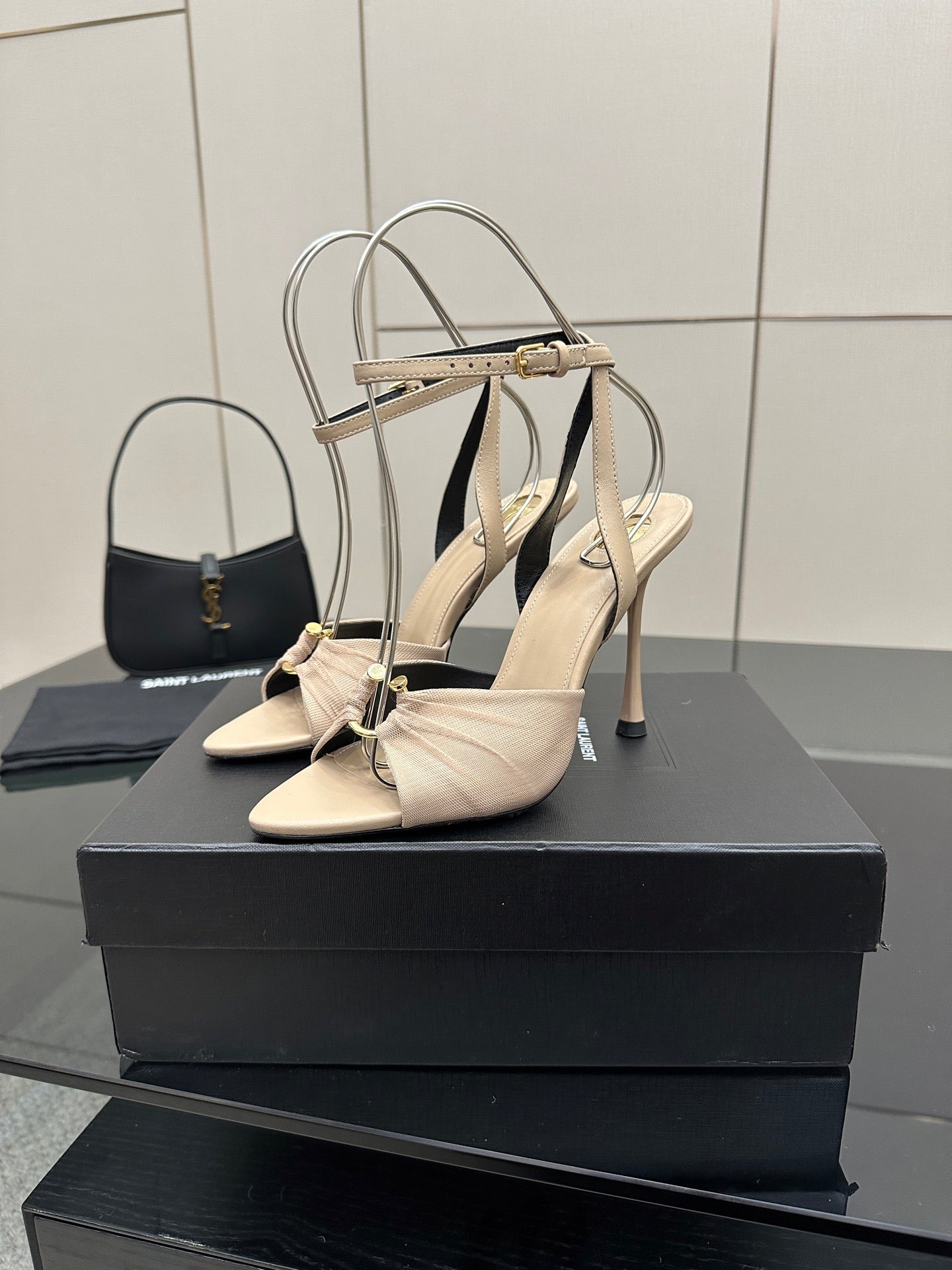 YSL ladies beige strappy heeled sandals with thin stiletto heels, side view