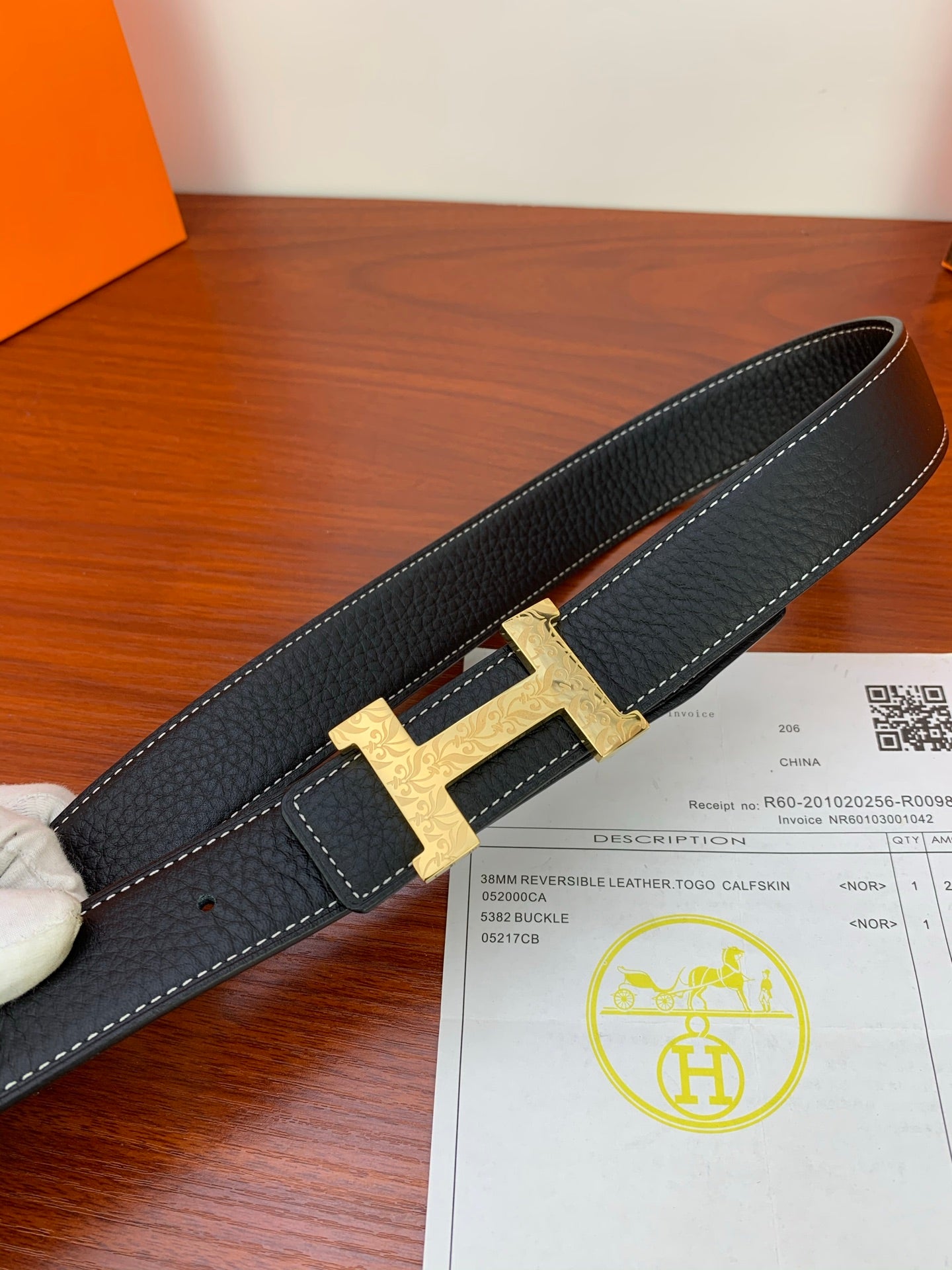Hermes reversible belt with gold H buckle and black textured leather strap