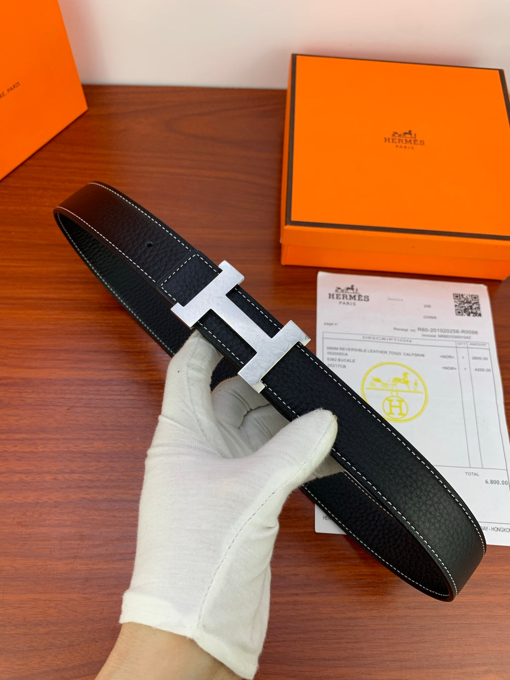 Hermes reversible leather belt with black strap and silver-tone buckle frame