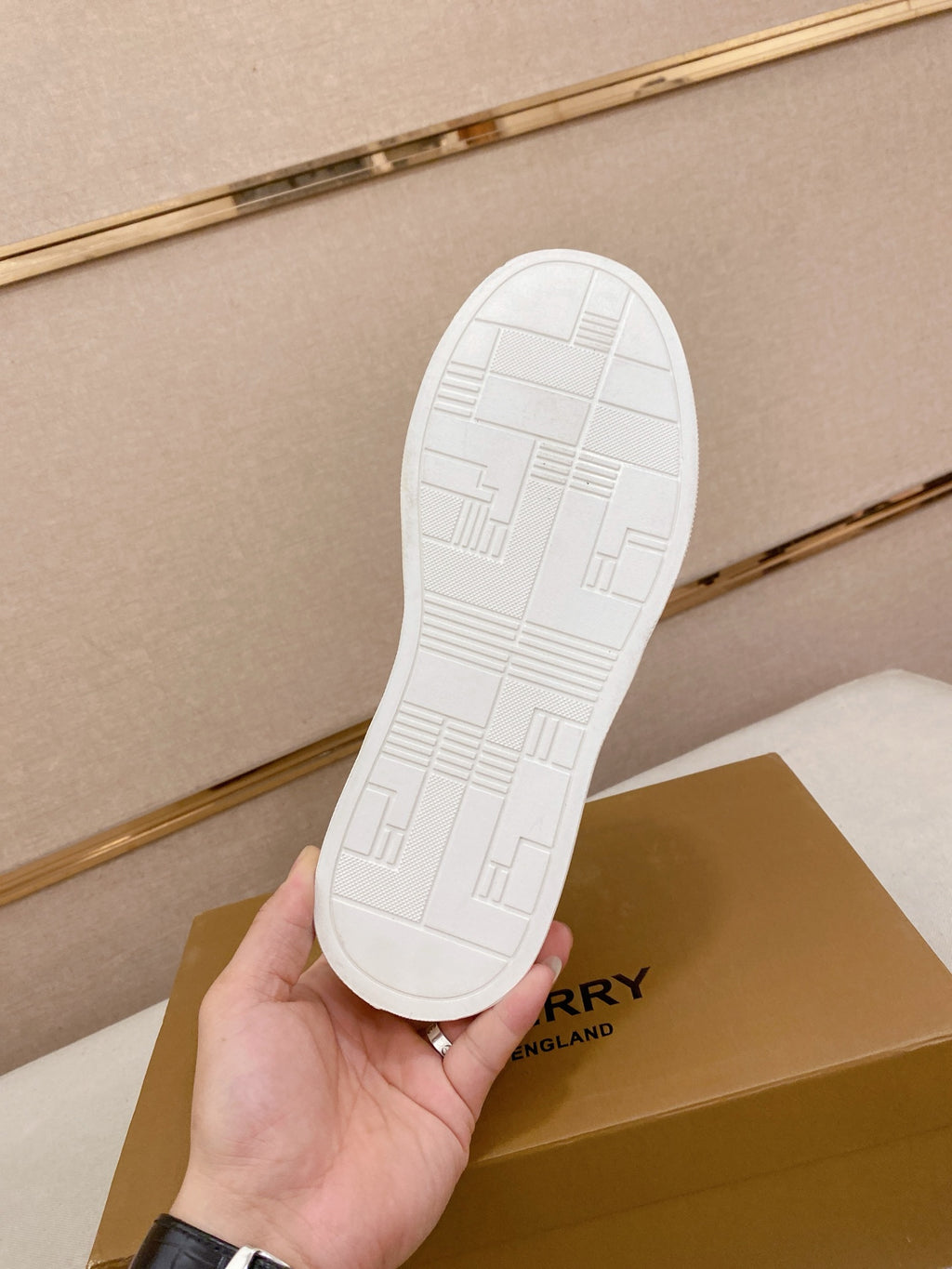 White Burberry sneaker outsole with grid and channel traction pattern