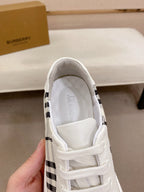 White Burberry sneaker interior view with padded collar and lace-up front