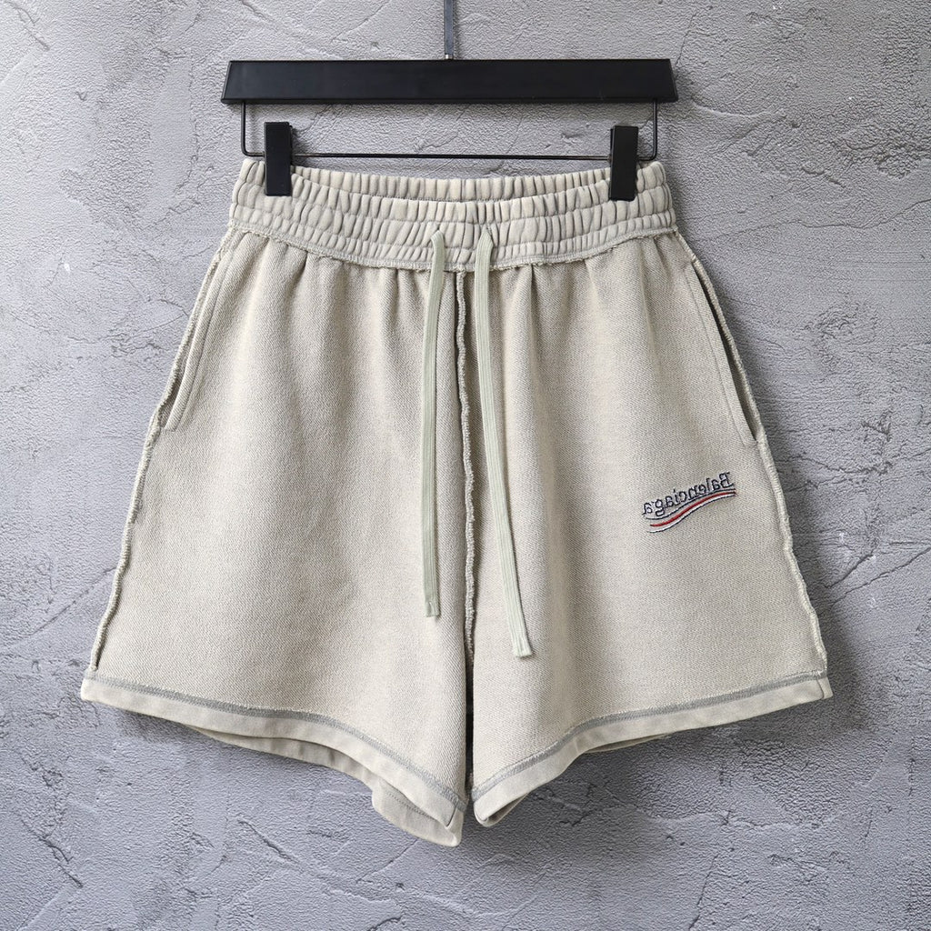 Beige drawstring shorts with elastic waistband and side pockets