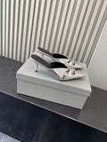 Balenciaga metallic silver heeled sandals, pointed toe with bow-style buckles