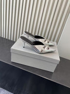 Balenciaga metallic silver heeled sandals, pointed toe with bow-style buckles