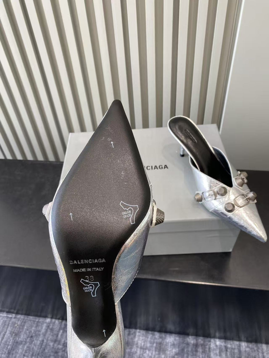 Metallic silver heeled sandals, dark insole with printed brand icons