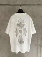 White short-sleeve T-shirt with large back floral graphic in gray and gold tones
