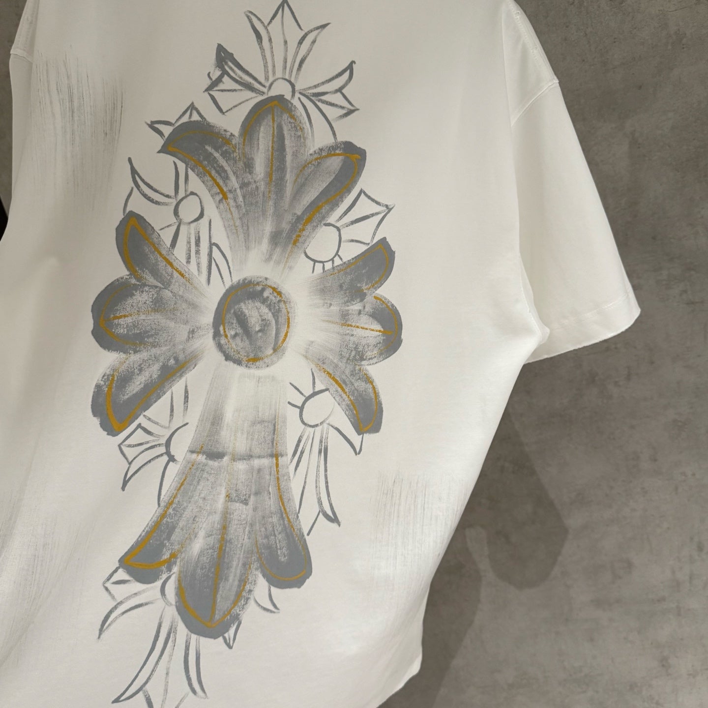 White short-sleeve T-shirt with large front floral graphic