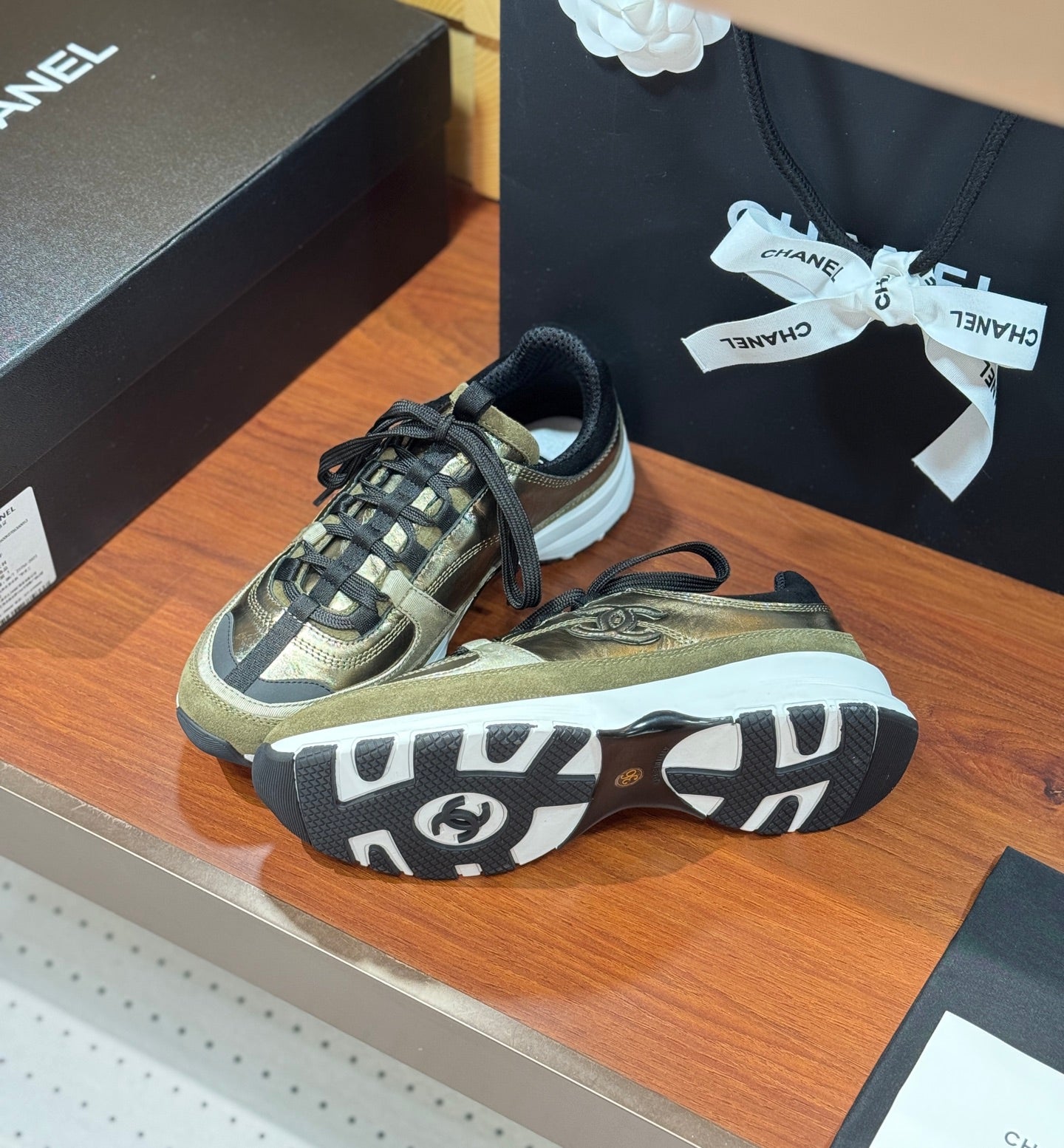 Chanel sneakers showing tread outsole with black and white rubber details