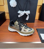 Chanel lace-up sneakers in olive-gold with black laces and white rubber sole