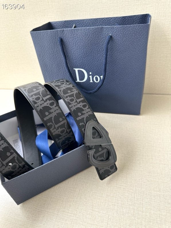Dior belt with dark monogram strap and gray-toned buckle, angled view.