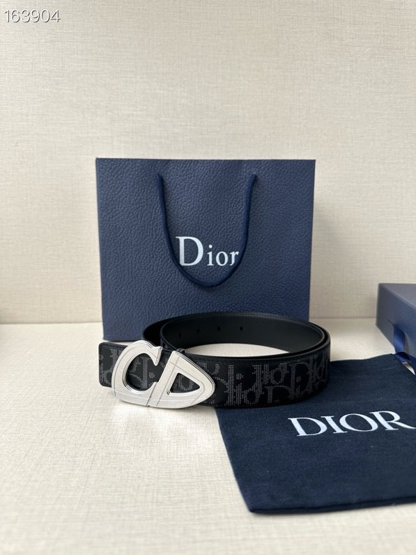 Dior belt with dark monogram strap and gold-tone CD buckle.