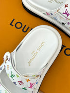 White slide sandal footbed with Louis Vuitton text and multicolor monogram strap