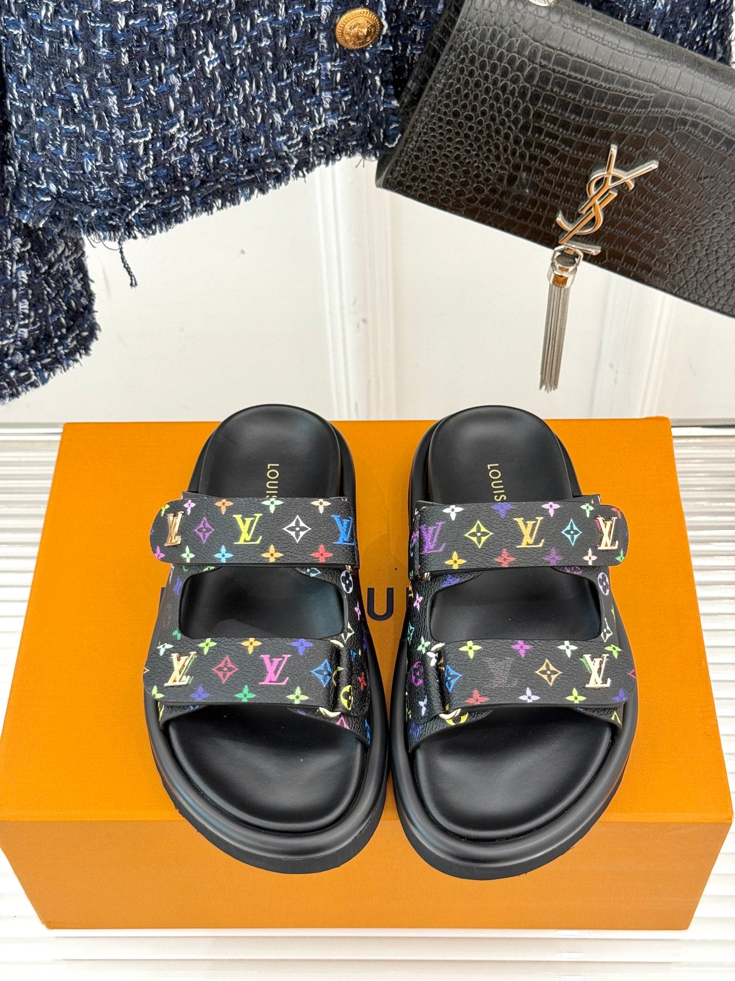 Louis Vuitton black slide sandals with multicolor monogram print, top view