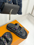 Louis Vuitton black slide sandals with multicolor monogram print and molded rubber sole