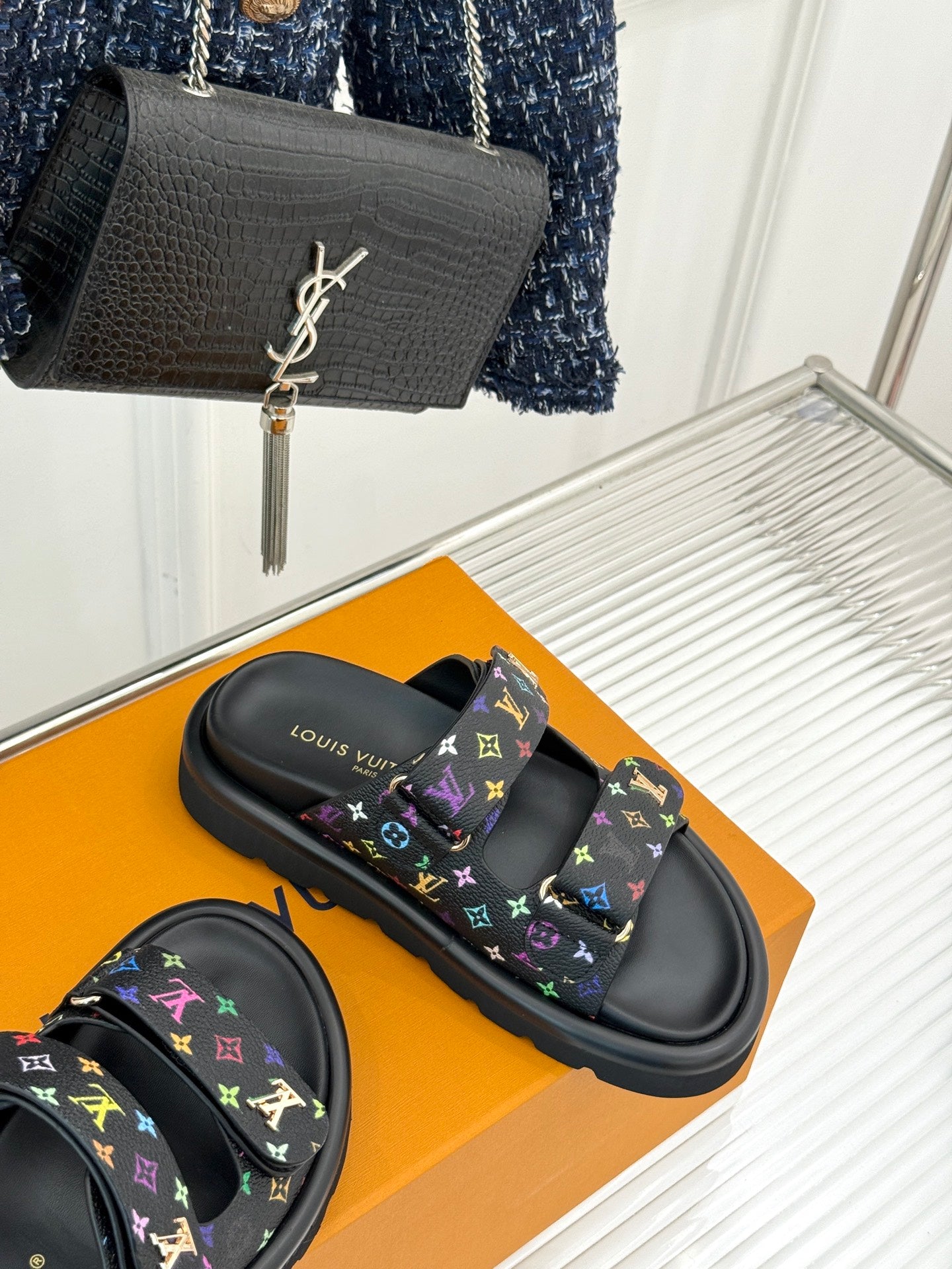 Louis Vuitton black slide sandals with multicolor monogram print and molded rubber sole