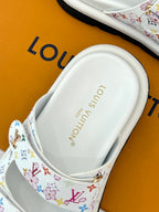 Louis Vuitton ladies luxury shoes, white footbed view with logo text on sandal