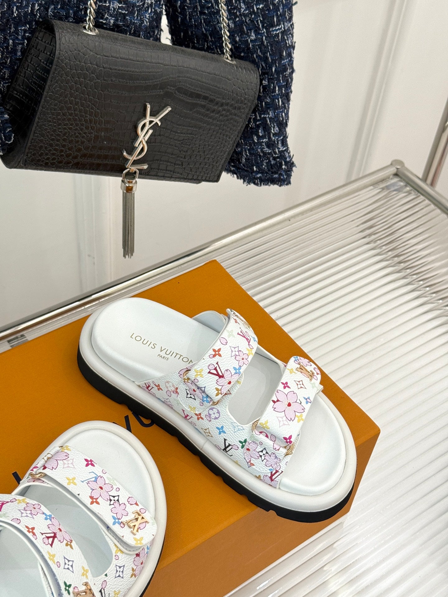 Louis Vuitton ladies luxury shoes, white slides with multicolor patterned strap on shoe box