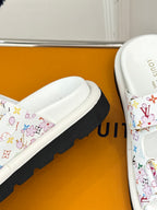 Louis Vuitton ladies luxury shoes, close-up of white slide sandal with multicolor print strap