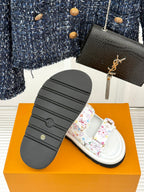 Louis Vuitton ladies luxury shoes, outsole view of white slide sandals with patterned straps