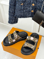 Ladies slide sandals set with floral monogram straps and black cushioned footbeds