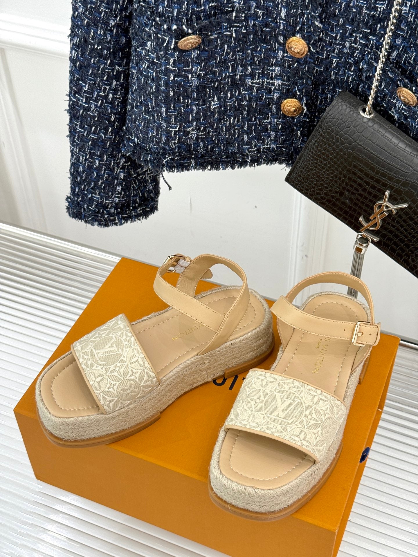 Beige espadrille sandals with wide straps and white monogram patterned bands