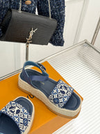Blue espadrille sandals with monogram canvas strap and flat jute platform sole