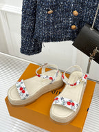 Espadrille sandals with white straps and red cherry print, open toe, braided sole.