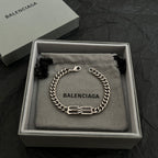 Balenciaga chain bracelet in box on fabric pouch with logo charm
