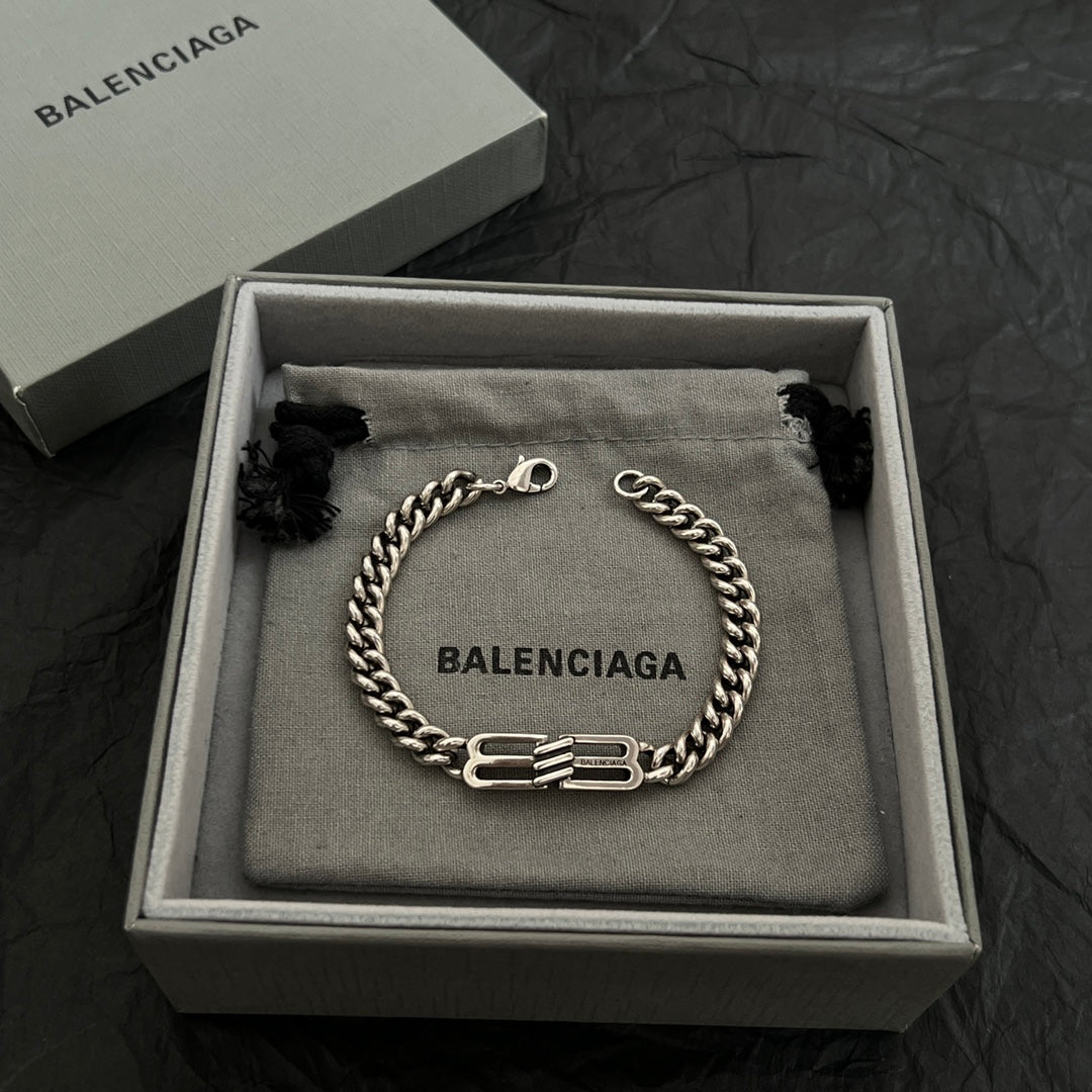 Balenciaga chain bracelet in box on fabric pouch with logo charm