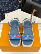 Blue espadrille sandals with cherry-print ankle straps and flat toe openings