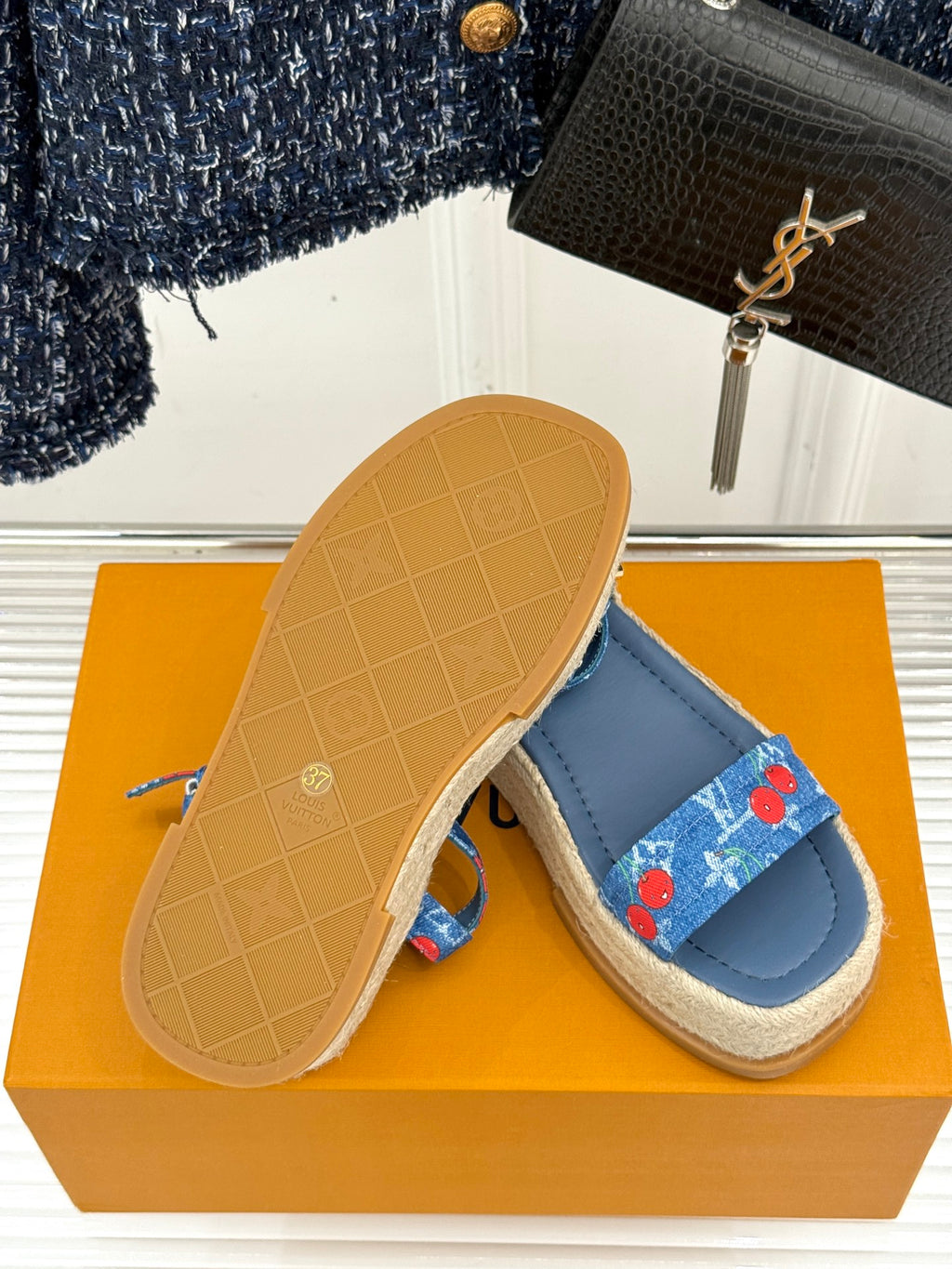 Blue espadrille sandals with cherry-print straps and tan outsole soles